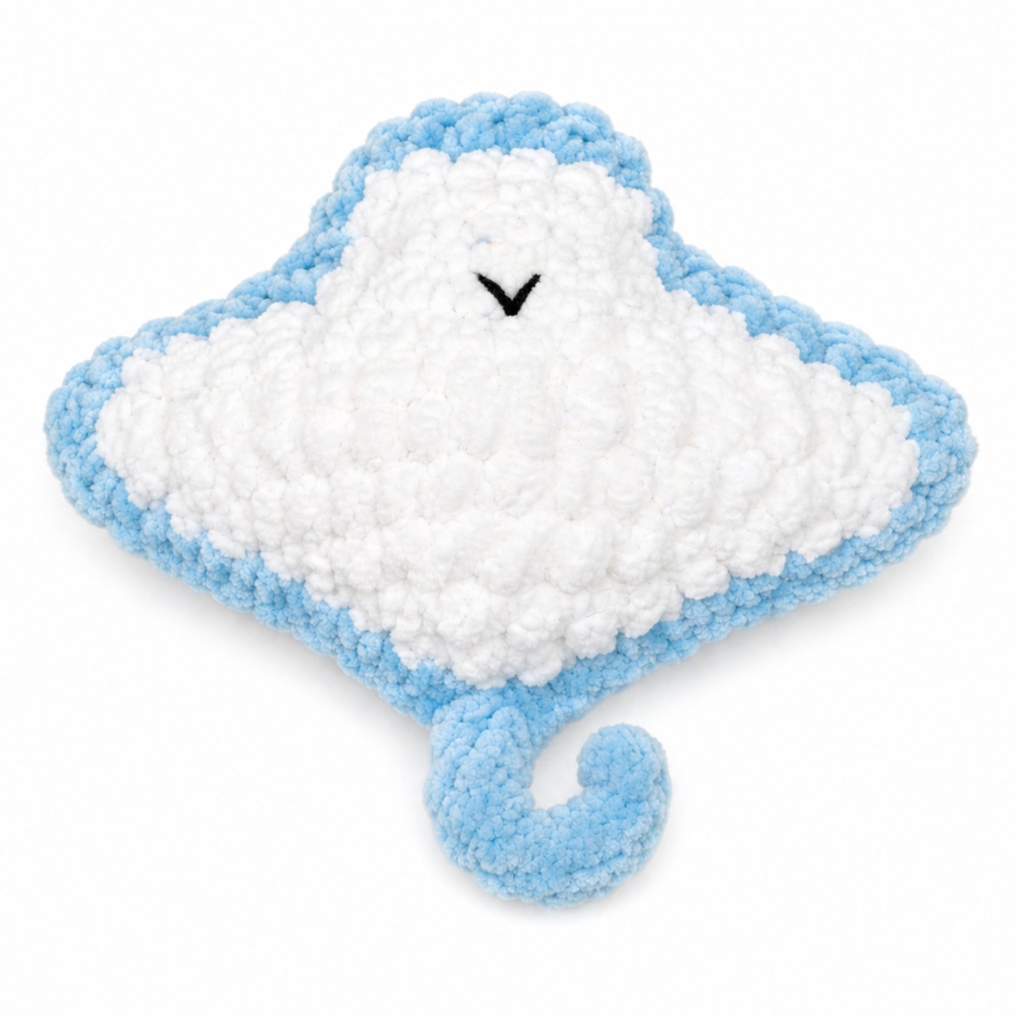 Close-up of soft plush yarn texture on handmade crochet baby stingray amigurumi