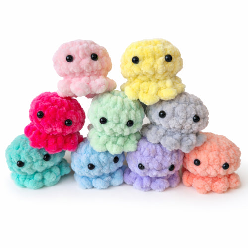 Colorful handmade crochet baby octopus plush toys in multiple colors, soft amigurumi mini octopus group display