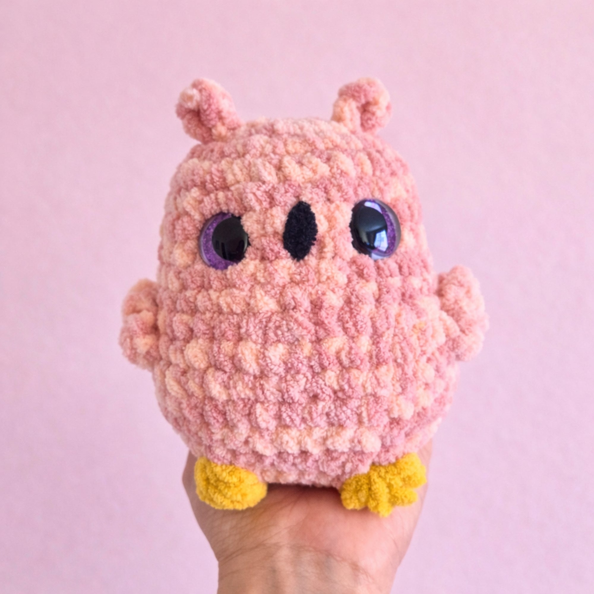 small crochet owl plush in hand