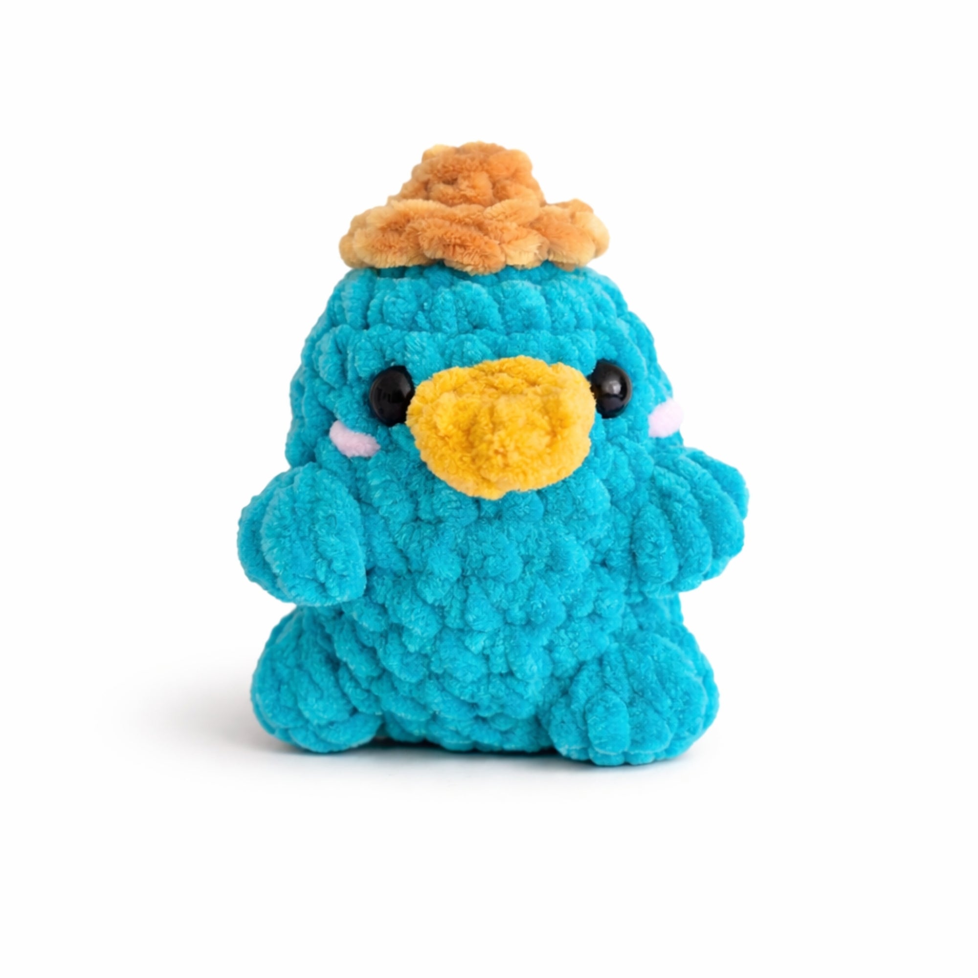 Handmade crochet platypus plush with gold hat, soft chenille amigurumi toy.