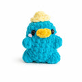 Handmade crochet platypus plush with yellow hat, soft chenille amigurumi toy.