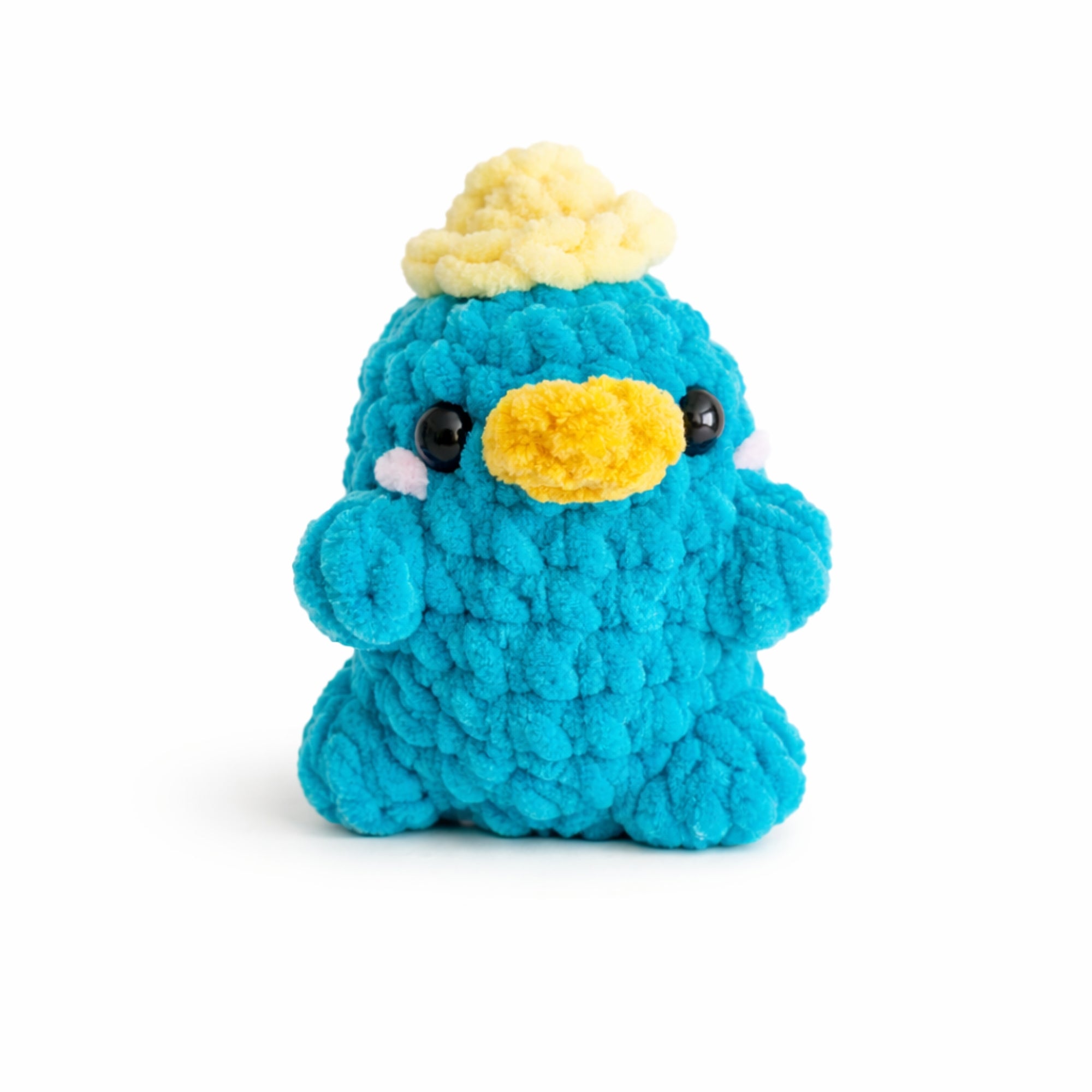 Handmade crochet platypus plush with yellow hat, soft chenille amigurumi toy.