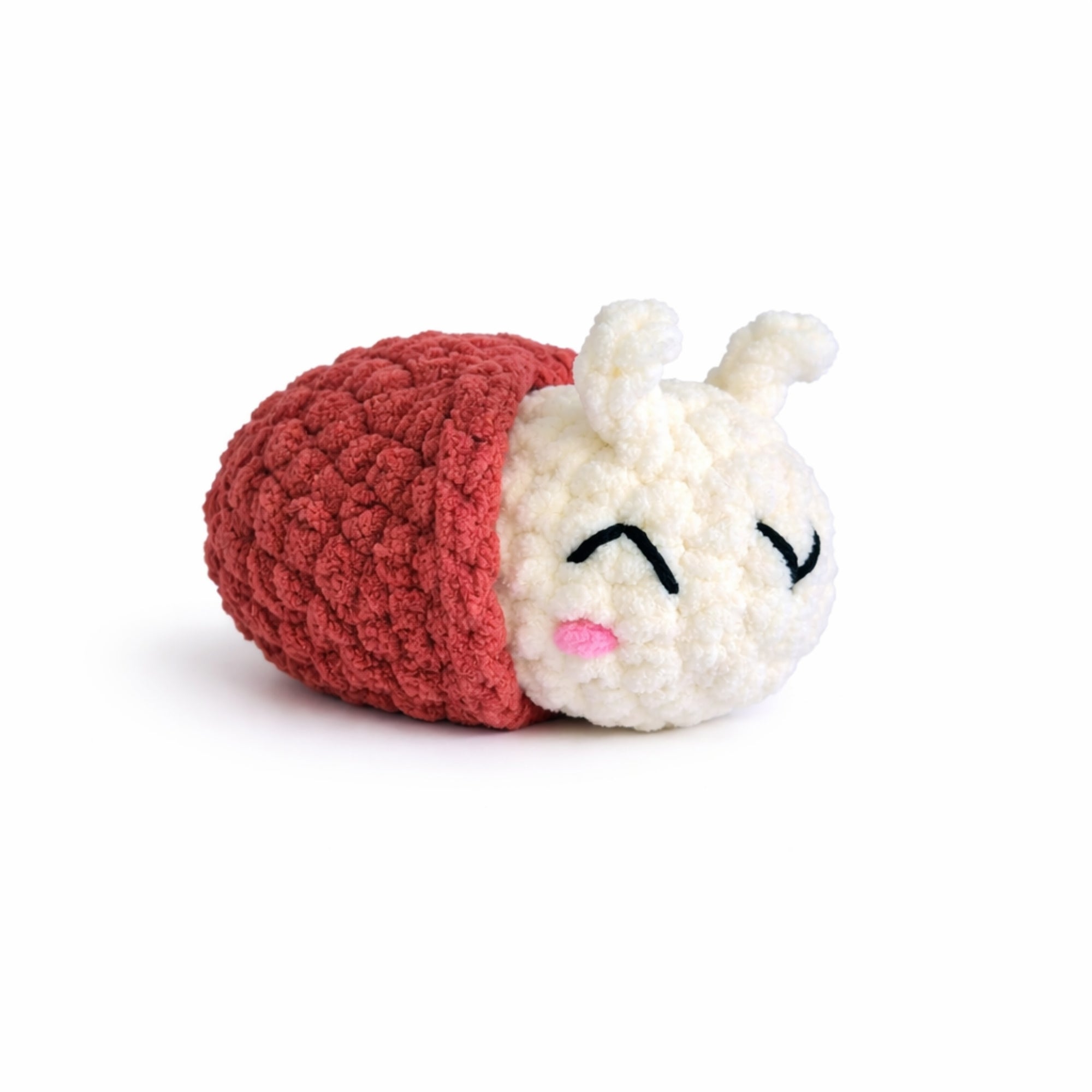 Handmade crochet snail amigurumi plush with brown shell.