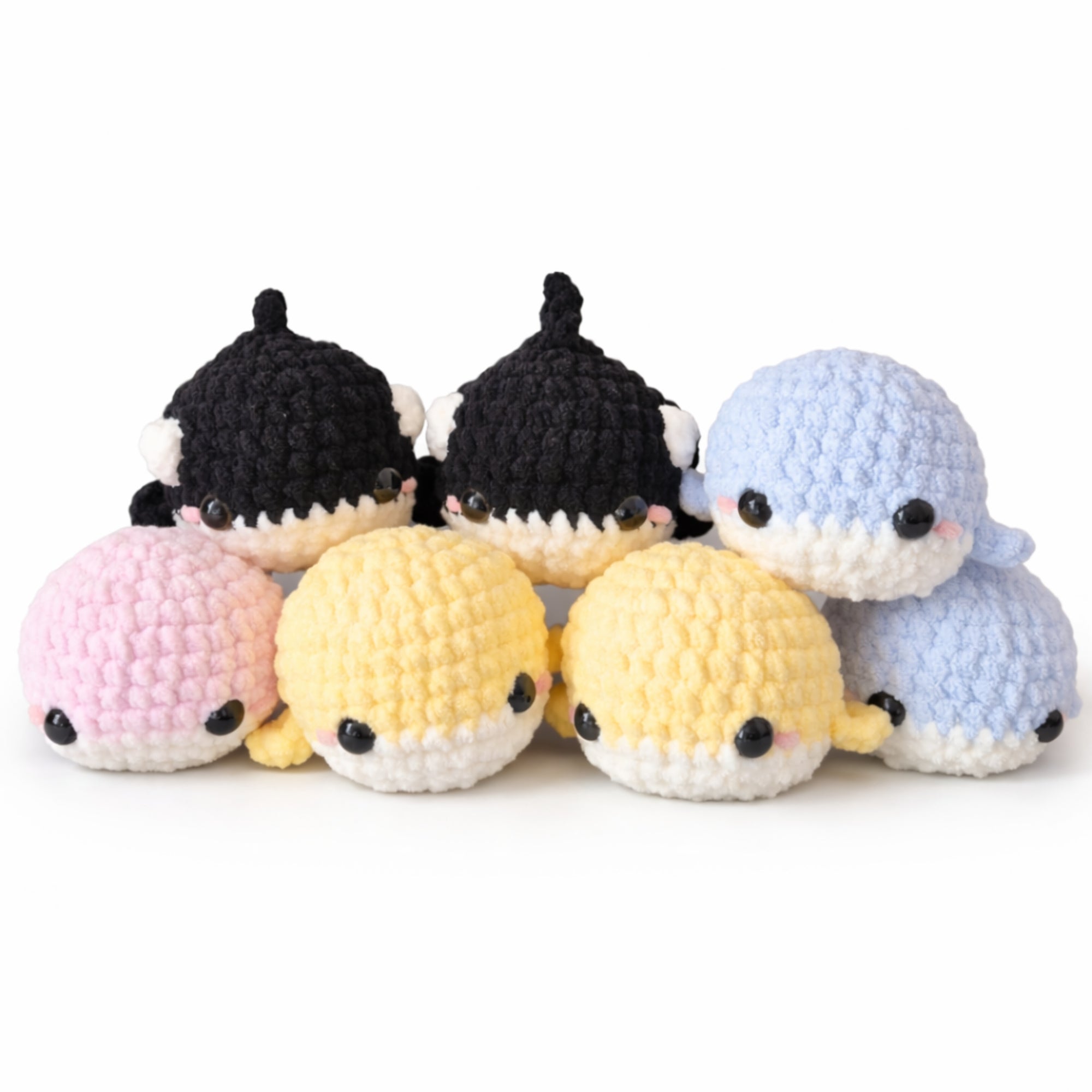 Cute handmade crochet whale plush amigurumi toys in pastel colors and orca design 