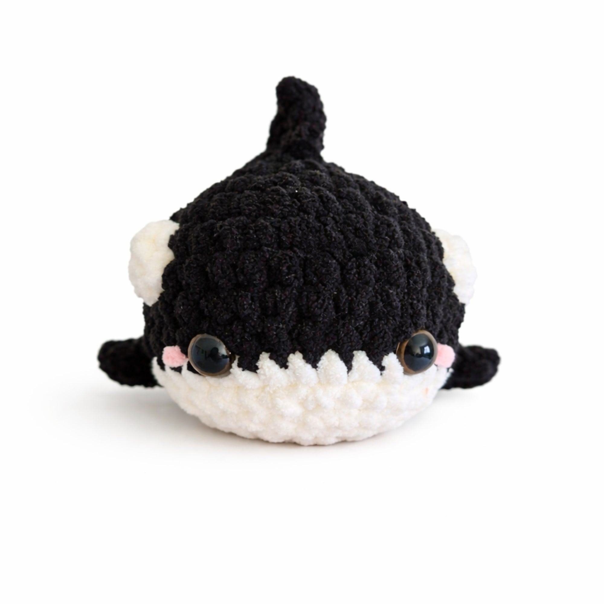 Handmade crochet baby whale amigurumi plush in black and white with soft chenille yarn and cute kawaii face