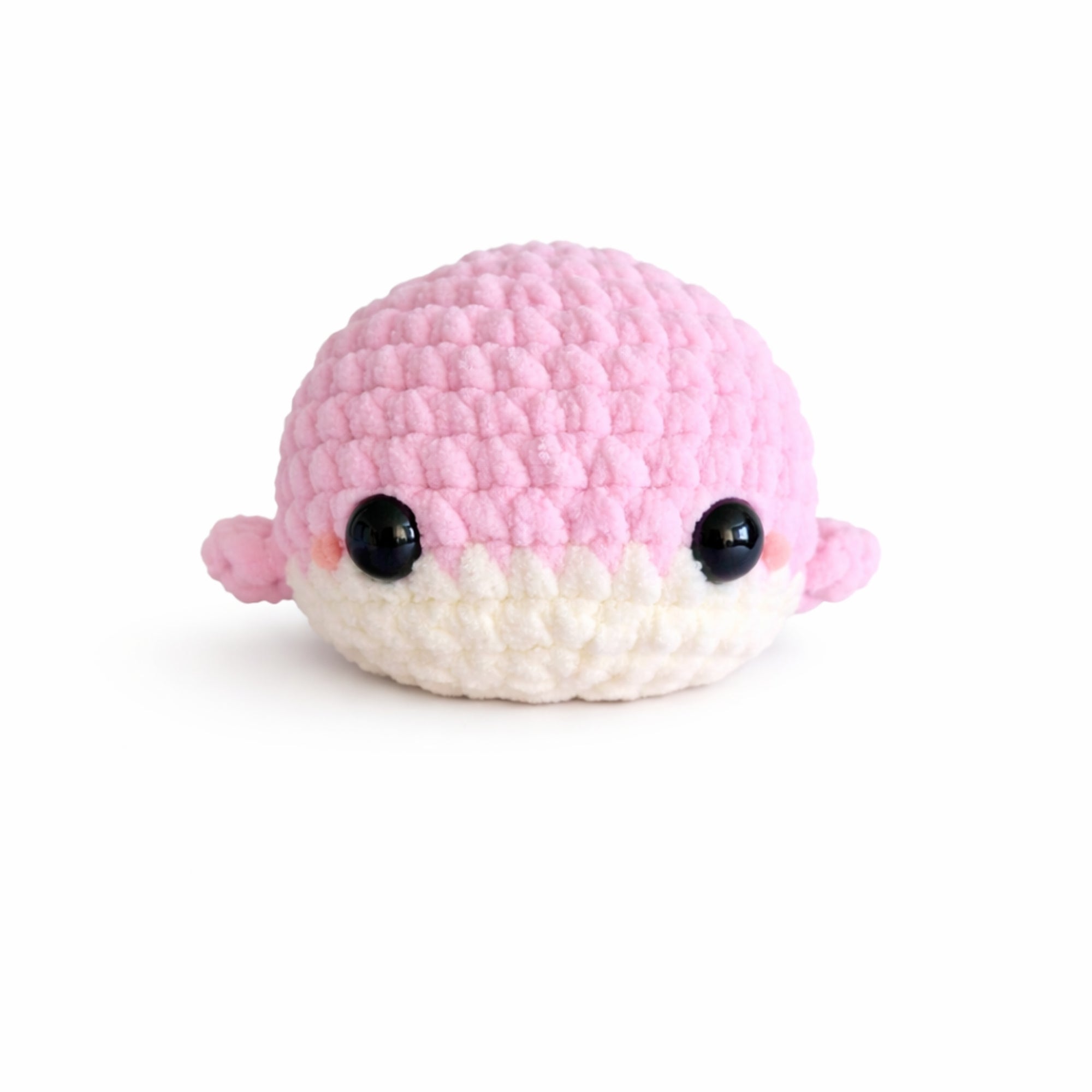 Handmade crochet baby whale amigurumi plush in soft pink chenille yarn with cute kawaii face