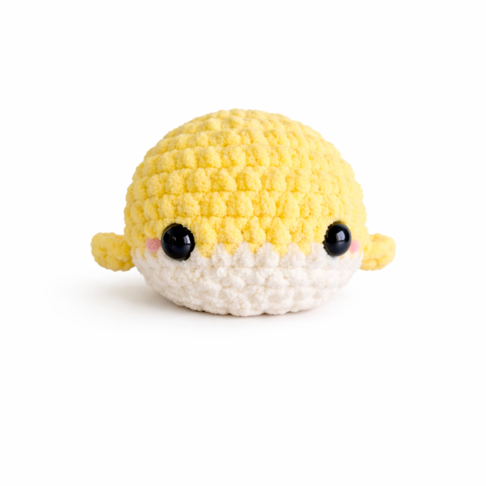 Handmade crochet baby whale amigurumi plush in soft yellow chenille yarn with cute kawaii face