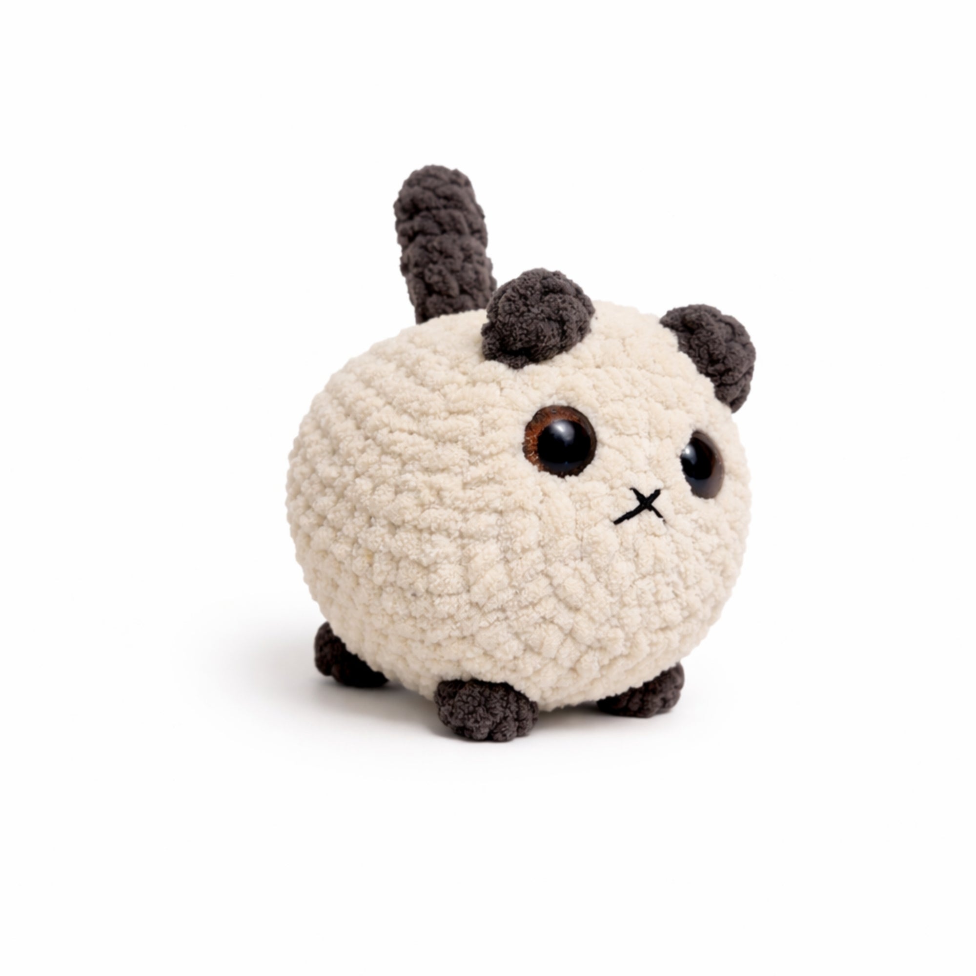 side view of handmade crochet cat amigurumi plush toy