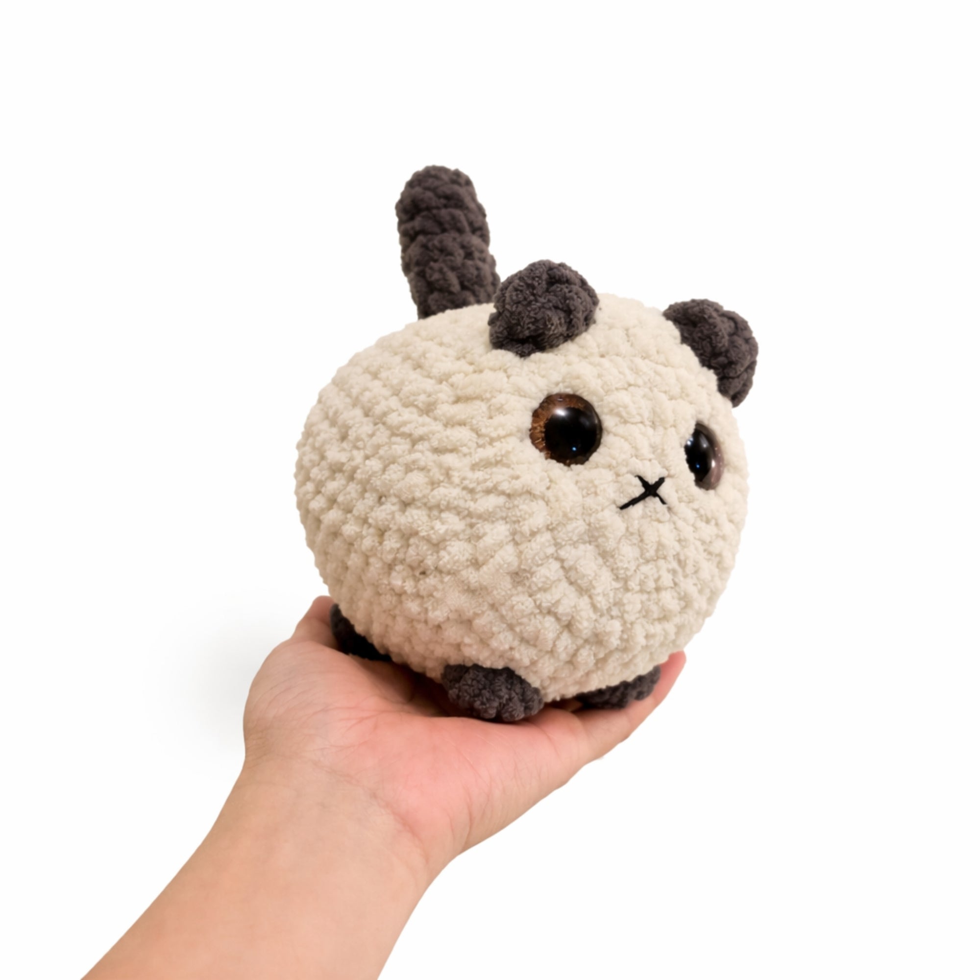 side view of handmade crochet cat amigurumi plush toy