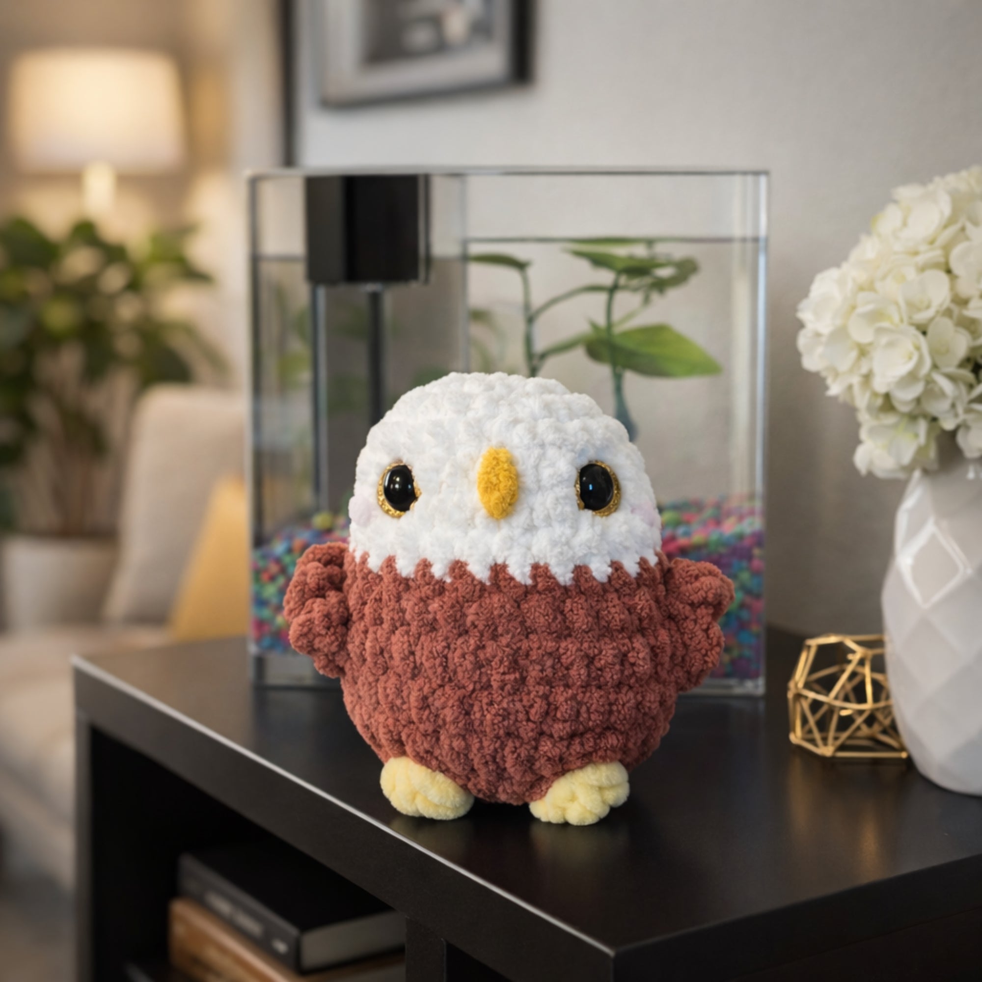 Handmade crochet owl plush amigurumi displayed as cute home decor on a table