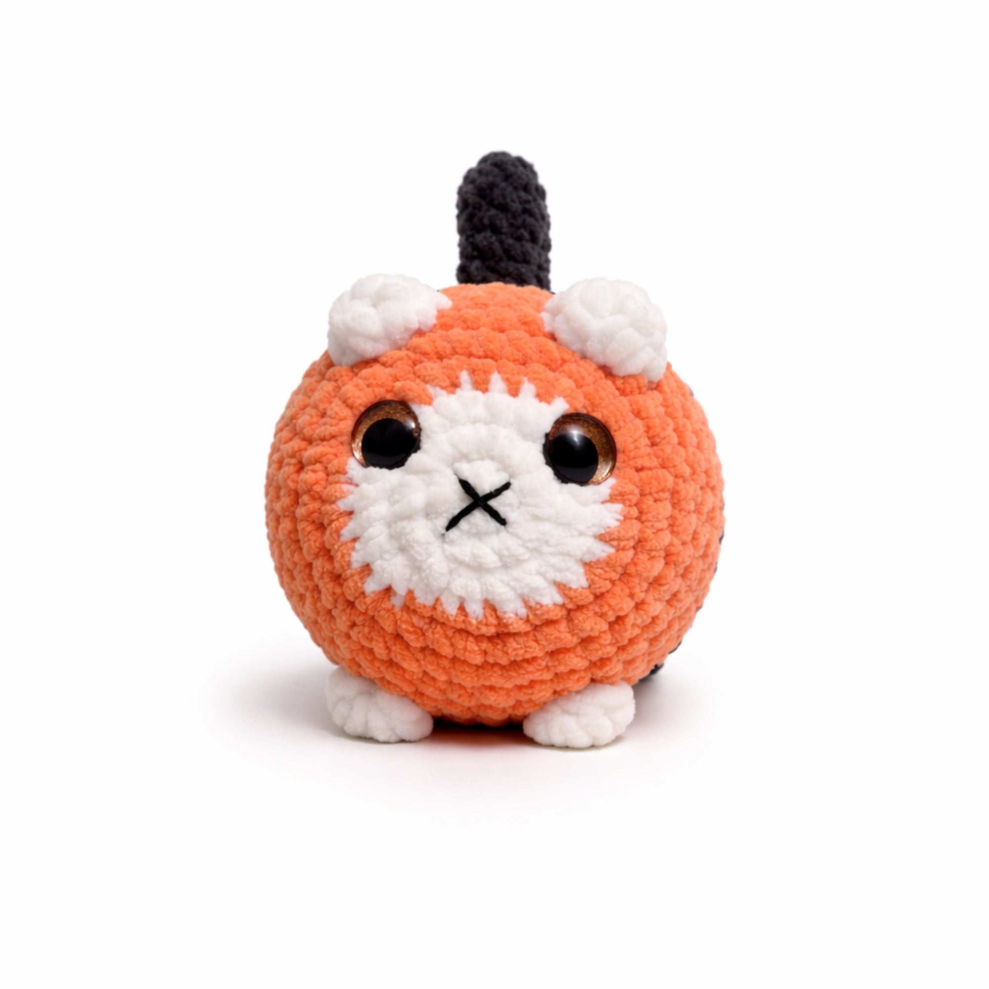 orange handmade crochet cat amigurumi plush toy with white face